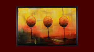 Handgemaltes Ölbild drei Bäume im Abendrot auf Leinwand, Orange, Gold und Rot mit Spiegelung, mit schwarzem Rahmen – Beispiel im Raum