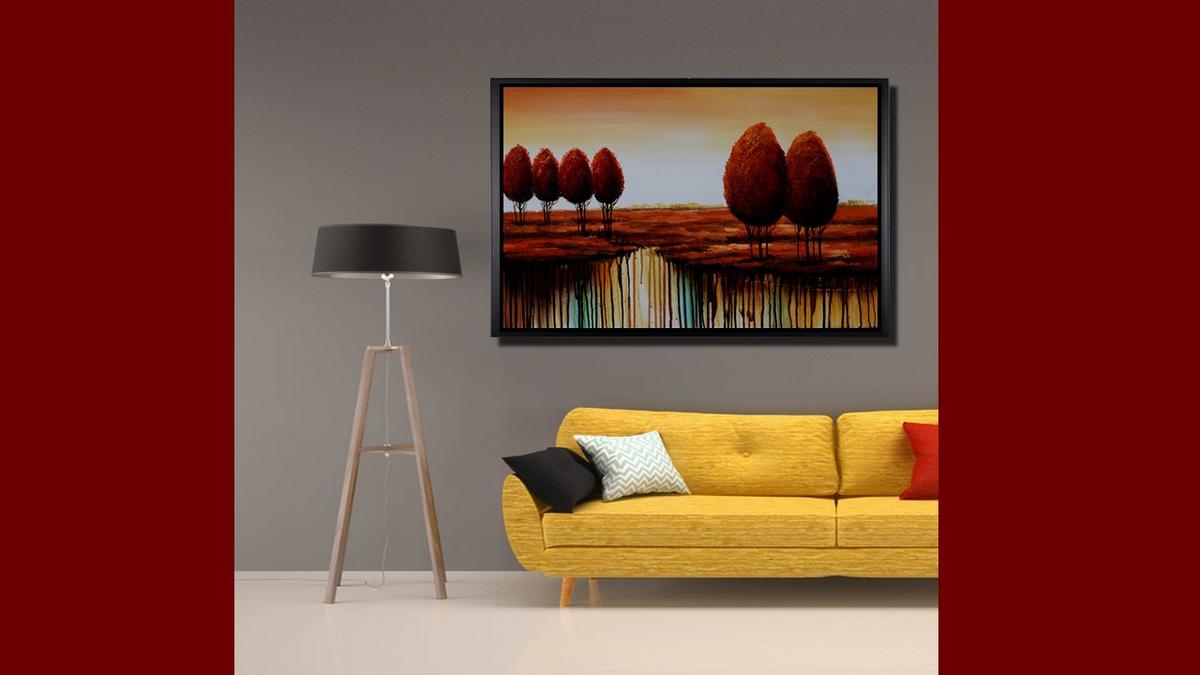 Handgemaltes Ölbild rote Bäume in weiter Landschaft auf Leinwand, modern mit Farbläufen in Rot und Türkis, mit schwarzem Rahmen – Beispiel im Raum