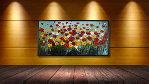 Handgemaltes Ölbild bunte Blumenwiese auf Leinwand, rote, gelbe und weisse Blüten vor türkisem Himmel, mit schwarzem Rahmen – Beispiel im Raum