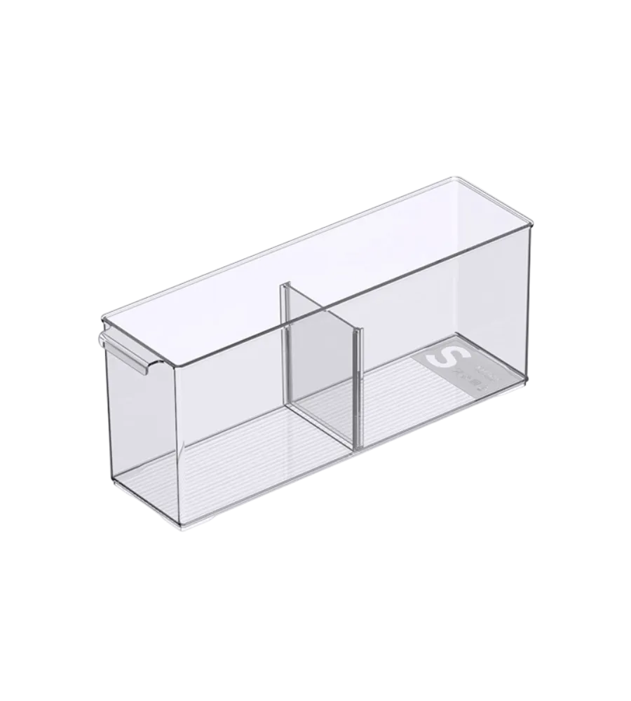 The KLAR storage container with compartments (extra long) from BNB x VCN is rectangular, transparent, empty, and has a divider for two clip-on compartments and a small "S" label inside.